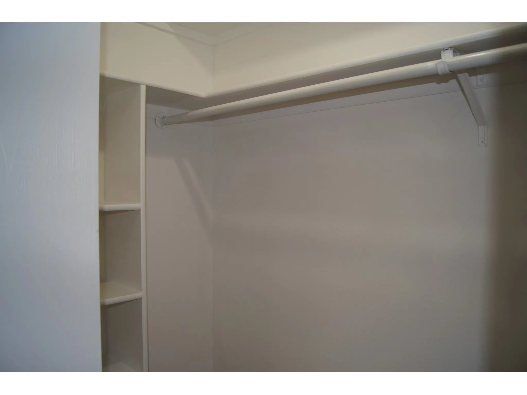 Master Bedroom Built-in closet system featuring multiple shelves and dual hanging rods