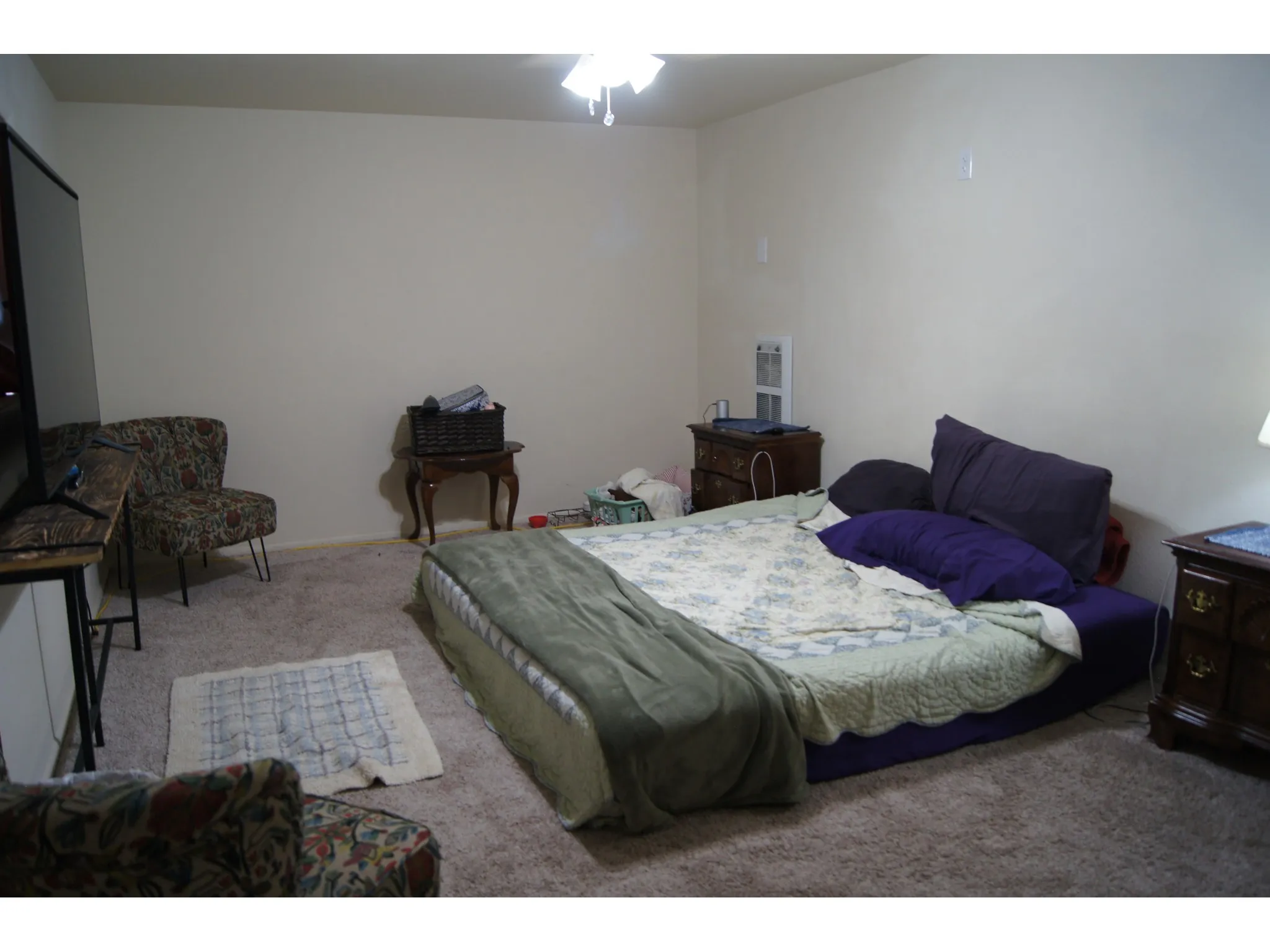 Bedroom 5 Carpeted room with neutral wall tones