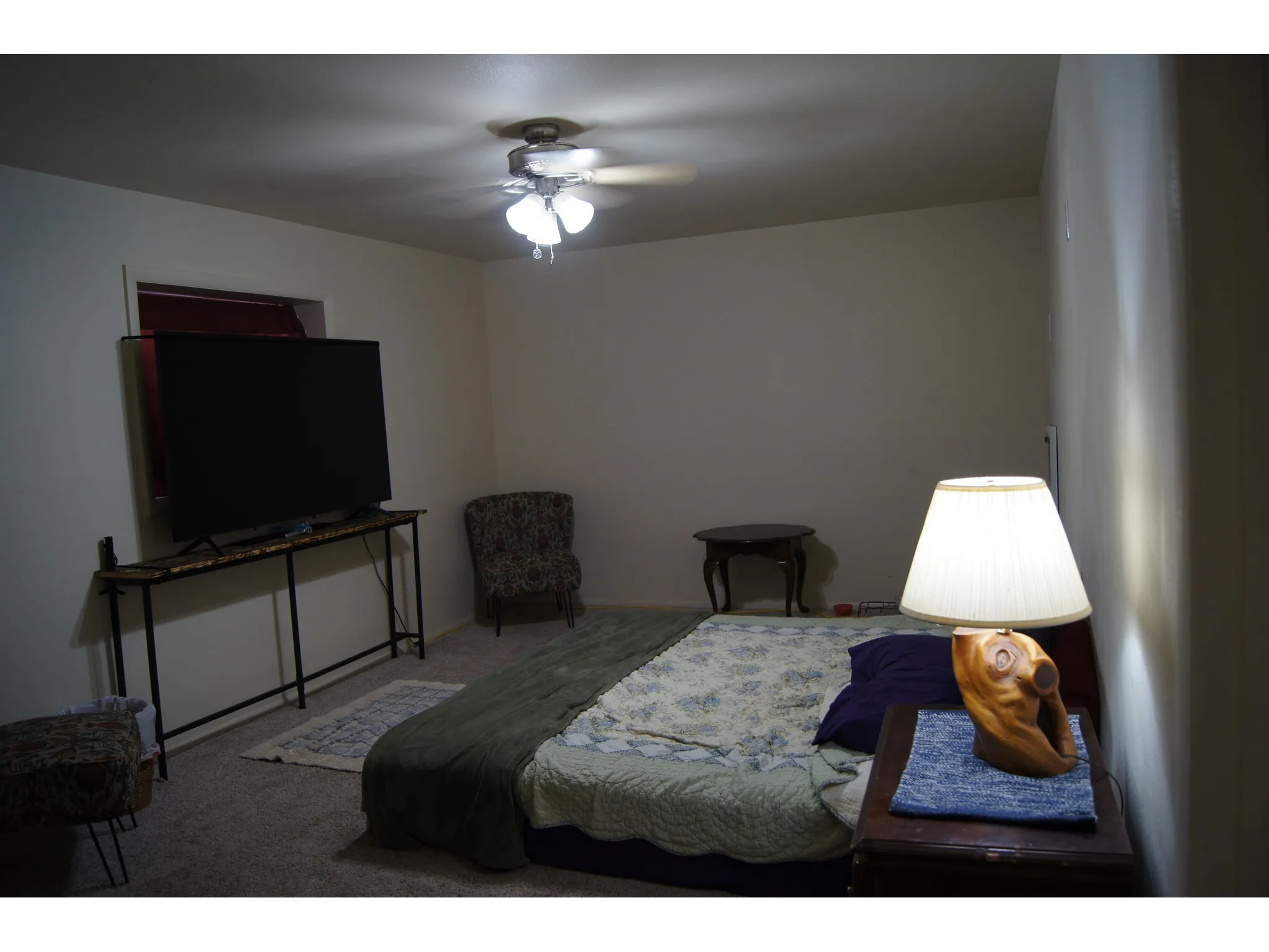 Bedroom 5 Carpeted room with neutral wall tones