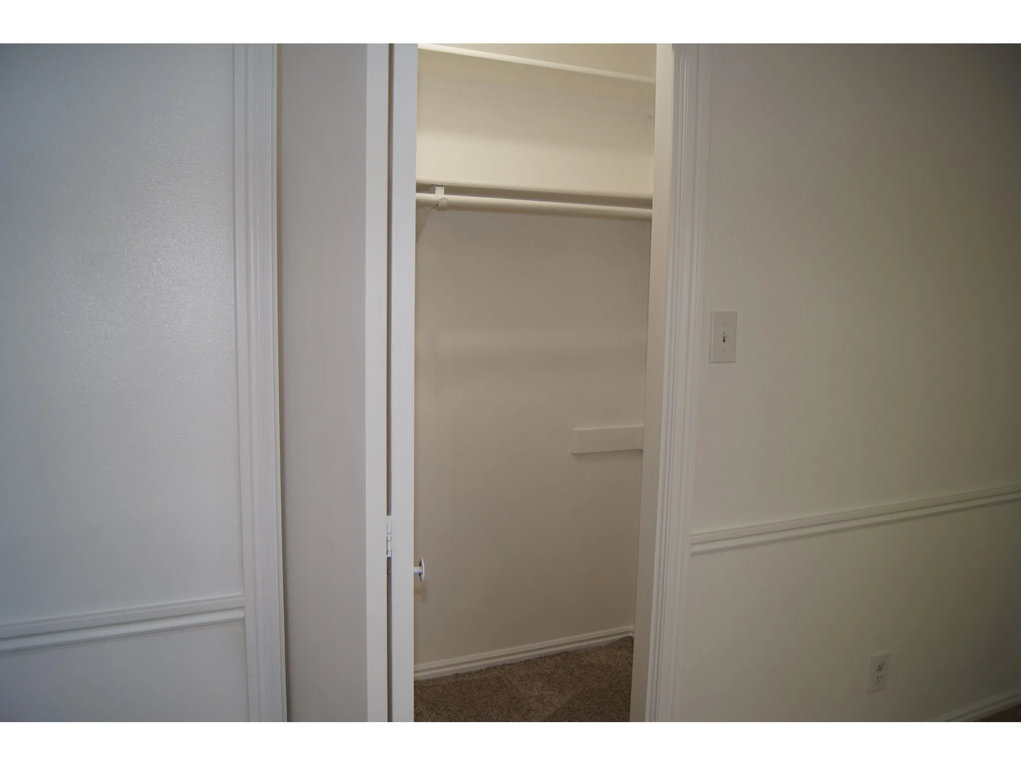 Master Bedroom Interior closet featuring a clothes rod, upper shelving, and neutral carpeting