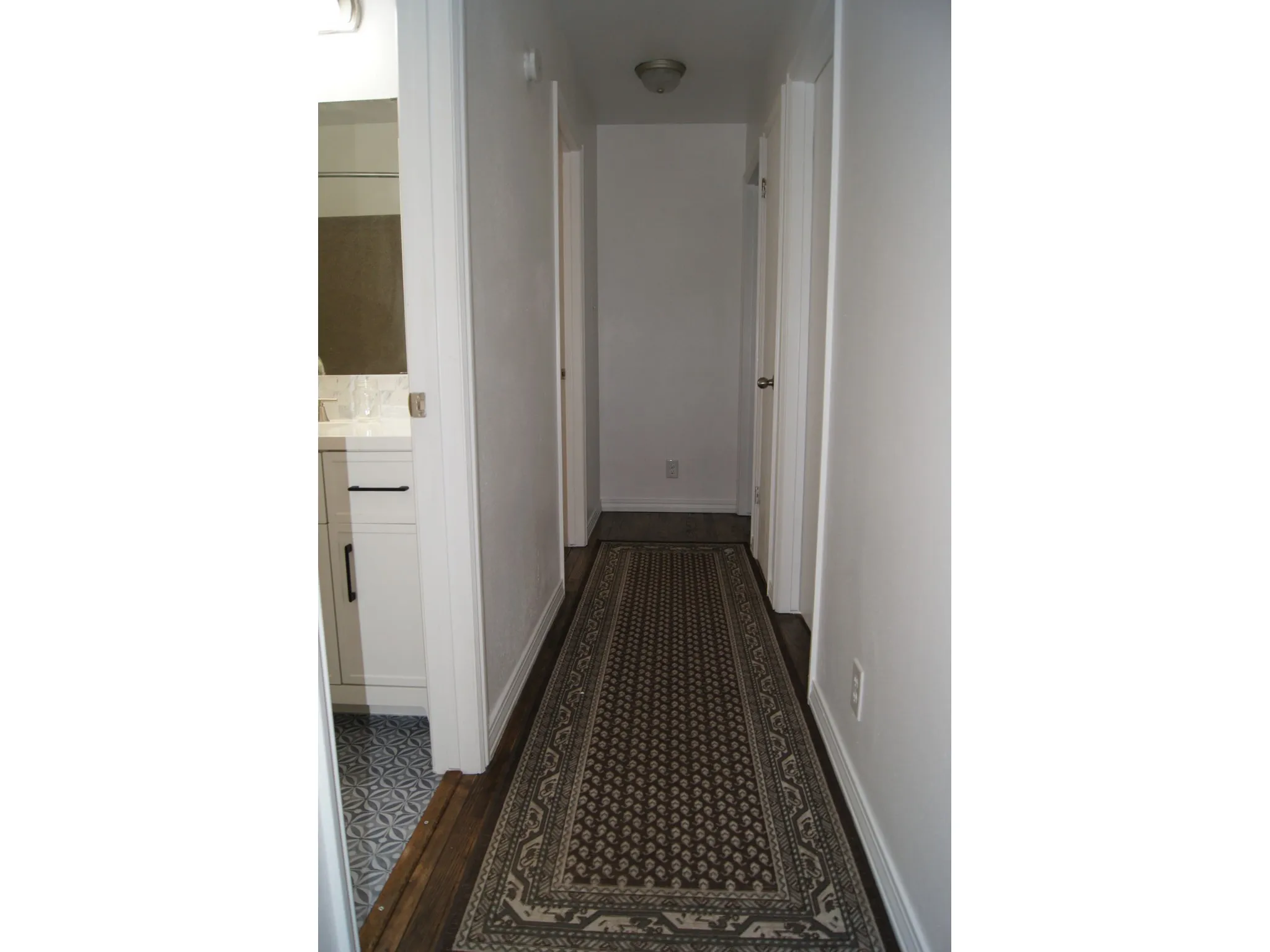 Hardwood flooring throughout the hallway