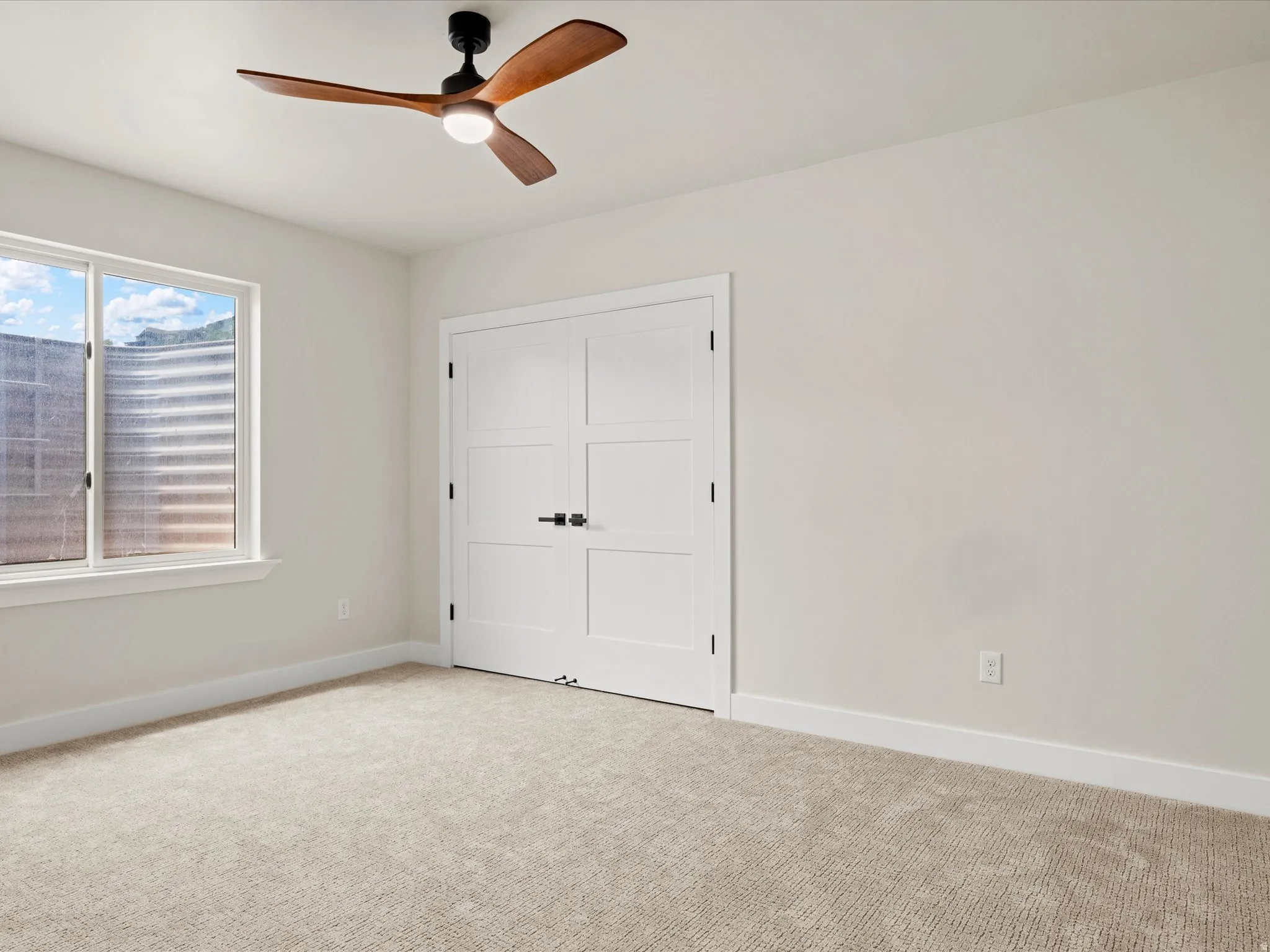 Neutral-toned carpeting paired with light wall paint