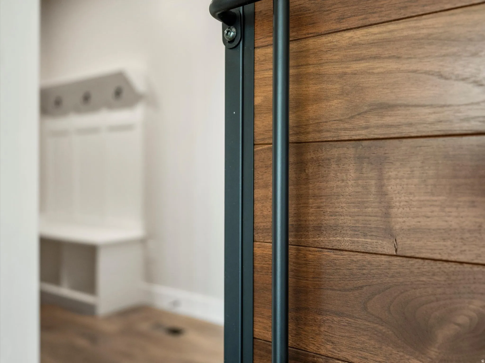 Wood-finish door with matte black hardware
