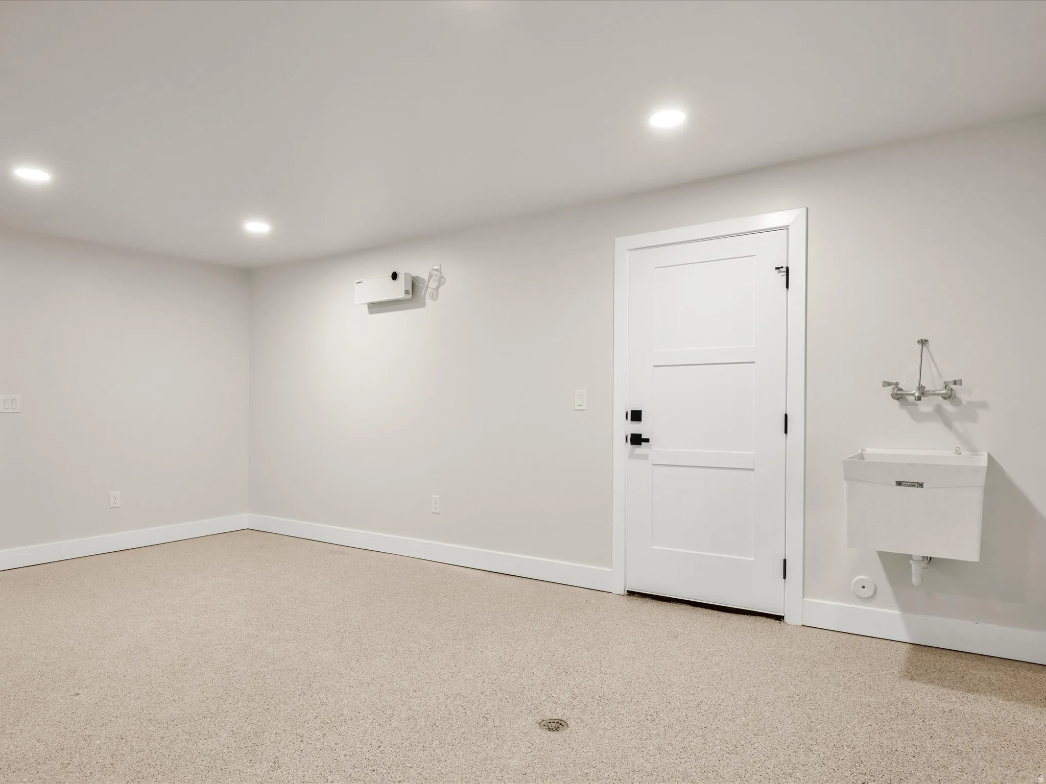 Neutral-toned flooring with a floor drain