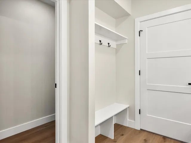 Built-in bench and shelving unit with coat hooks