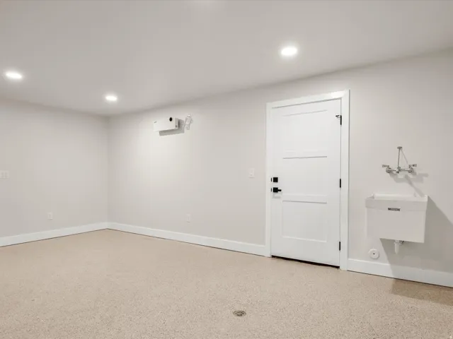 Neutral-toned flooring with a floor drain