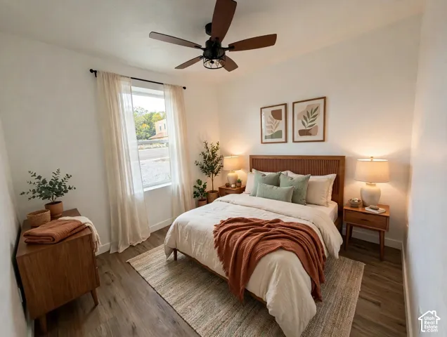Neutral interior with wood-finish flooring, a single window, and a central ceiling fan with integrated lighting