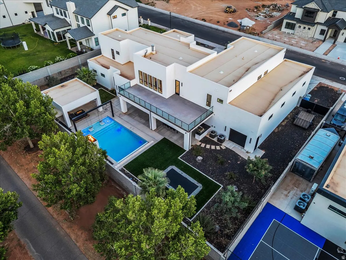 Modern architecture featuring a multi-level design, flat roofs, and a private swimming pool