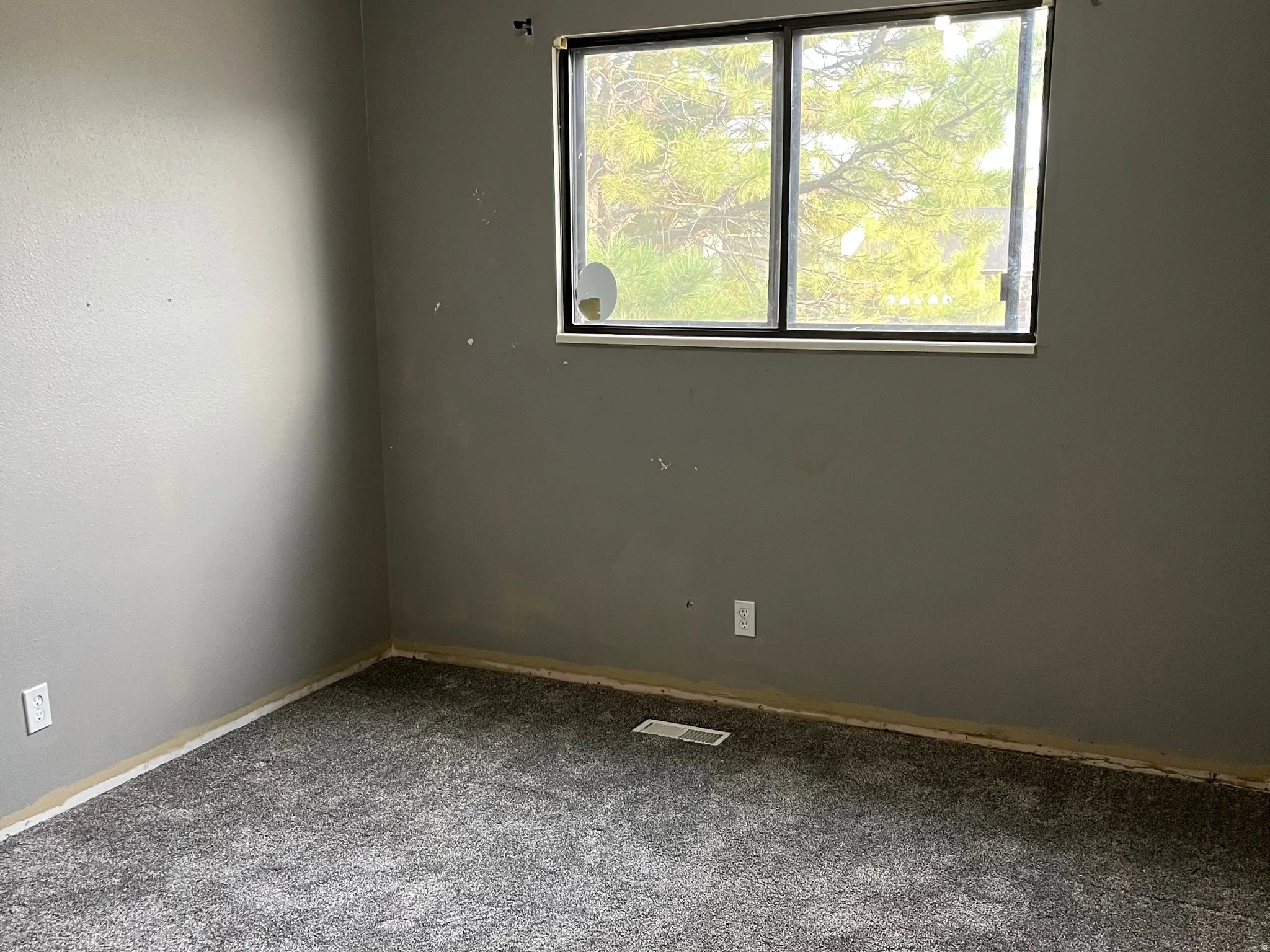 2nd bedroom upstairs. Needs baseboards.  New carpeting was recently installed.