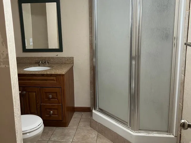 Bathroom with a shower. Located in the basement.