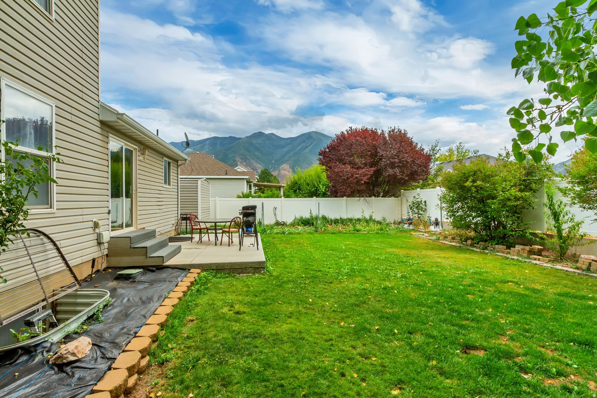 Spacious backyard featuring a substantial lawn area