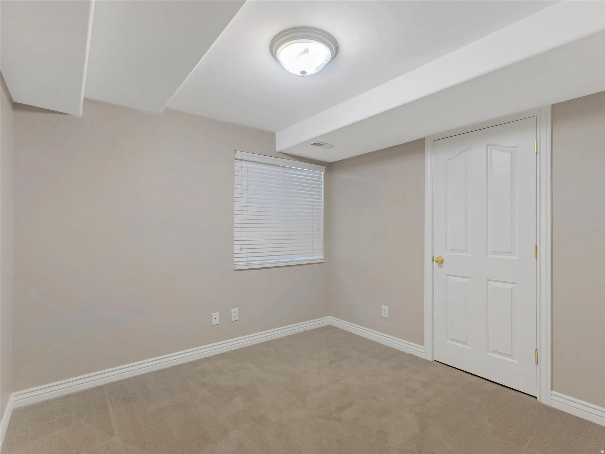 Bedroom 5-Carpeted room featuring a white paneled door, flush-mount ceiling light, white baseboards, and a window with blinds