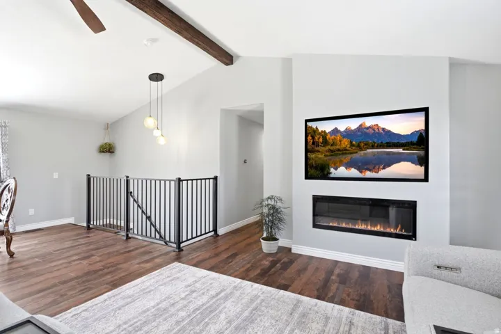 Integrated electric fireplace feature wall with a large display above