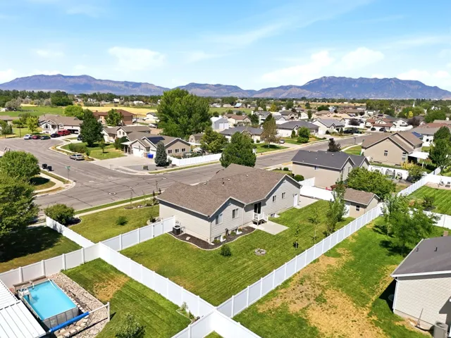 Aerial perspective showcasing a residential area with varied home styles and mature landscaping