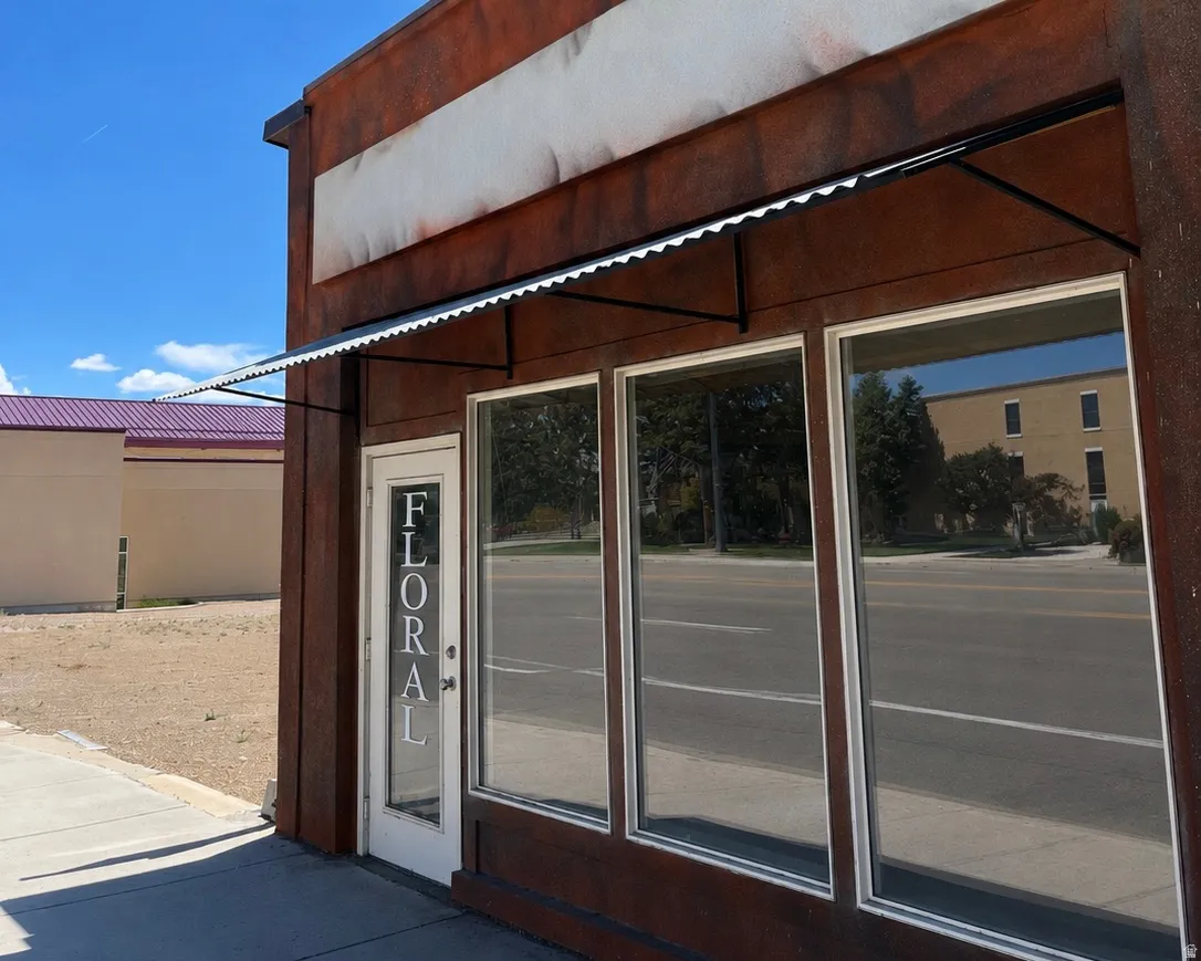 Commercial storefront featuring a corrugated metal awning