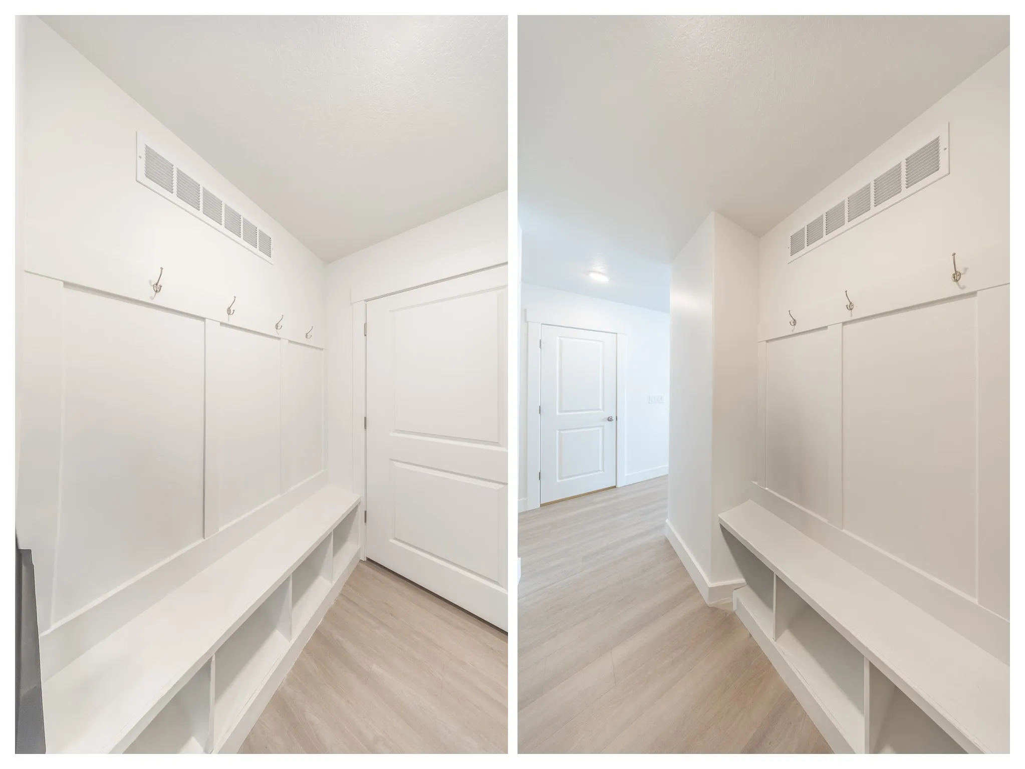 Entryway featuring built-in bench seating with cubby storage, wainscoting, and wall-mounted hooks