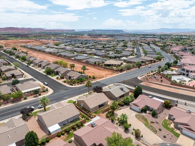 Expansive residential development featuring paved streets and varied desert landscaping