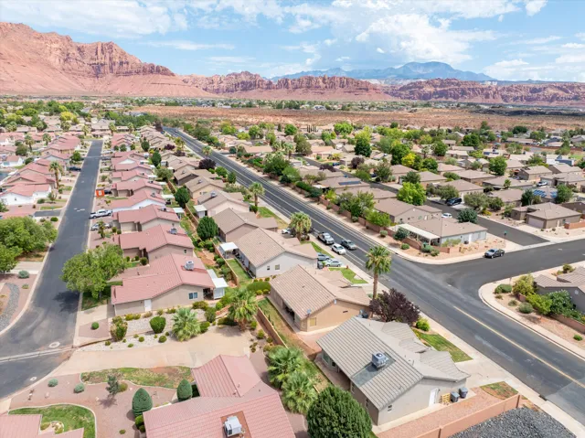 Expansive residential community featuring single-story properties with tile roofs