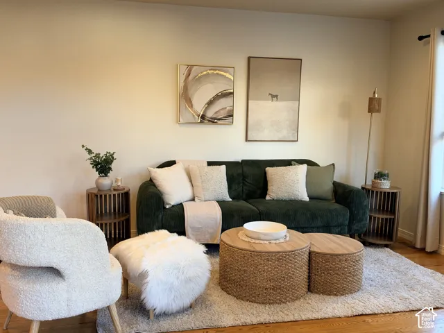 Neutral-toned walls paired with polished wood-finish flooring