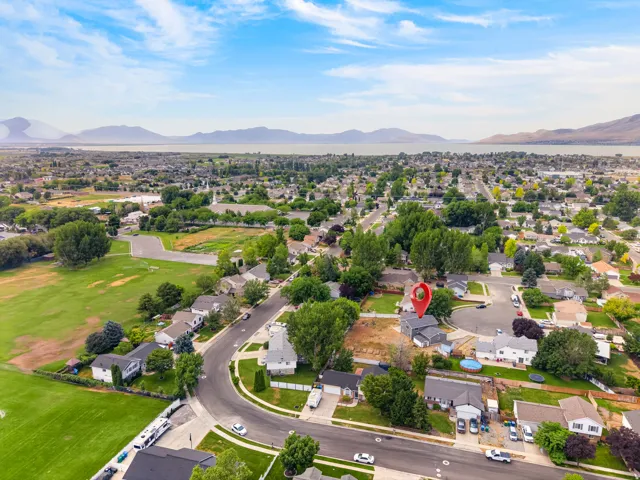Aerial perspective showcasing a residential community with abundant mature trees