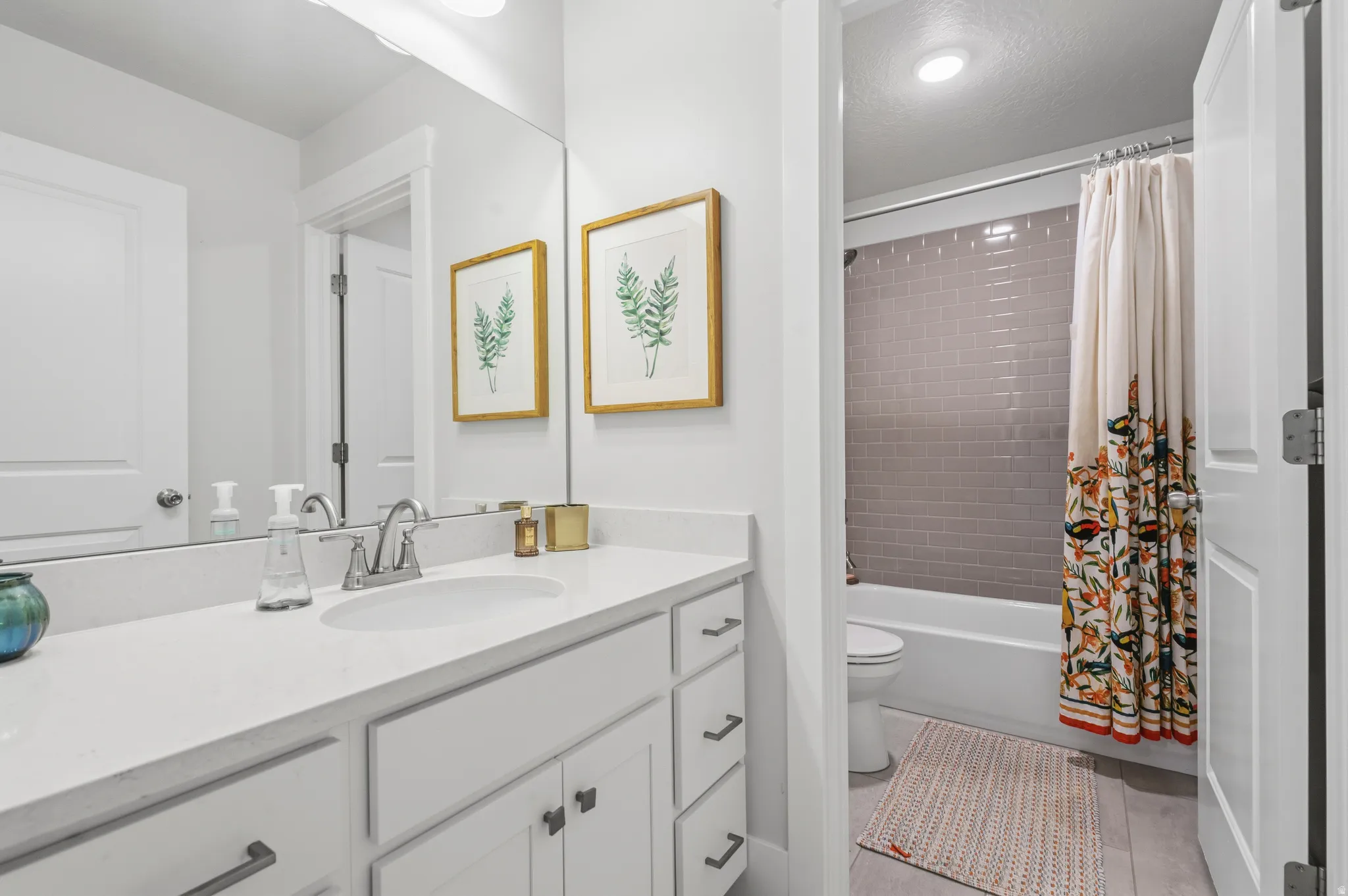 Bathroom vanity with a rectangular undermount sink and polished chrome faucet