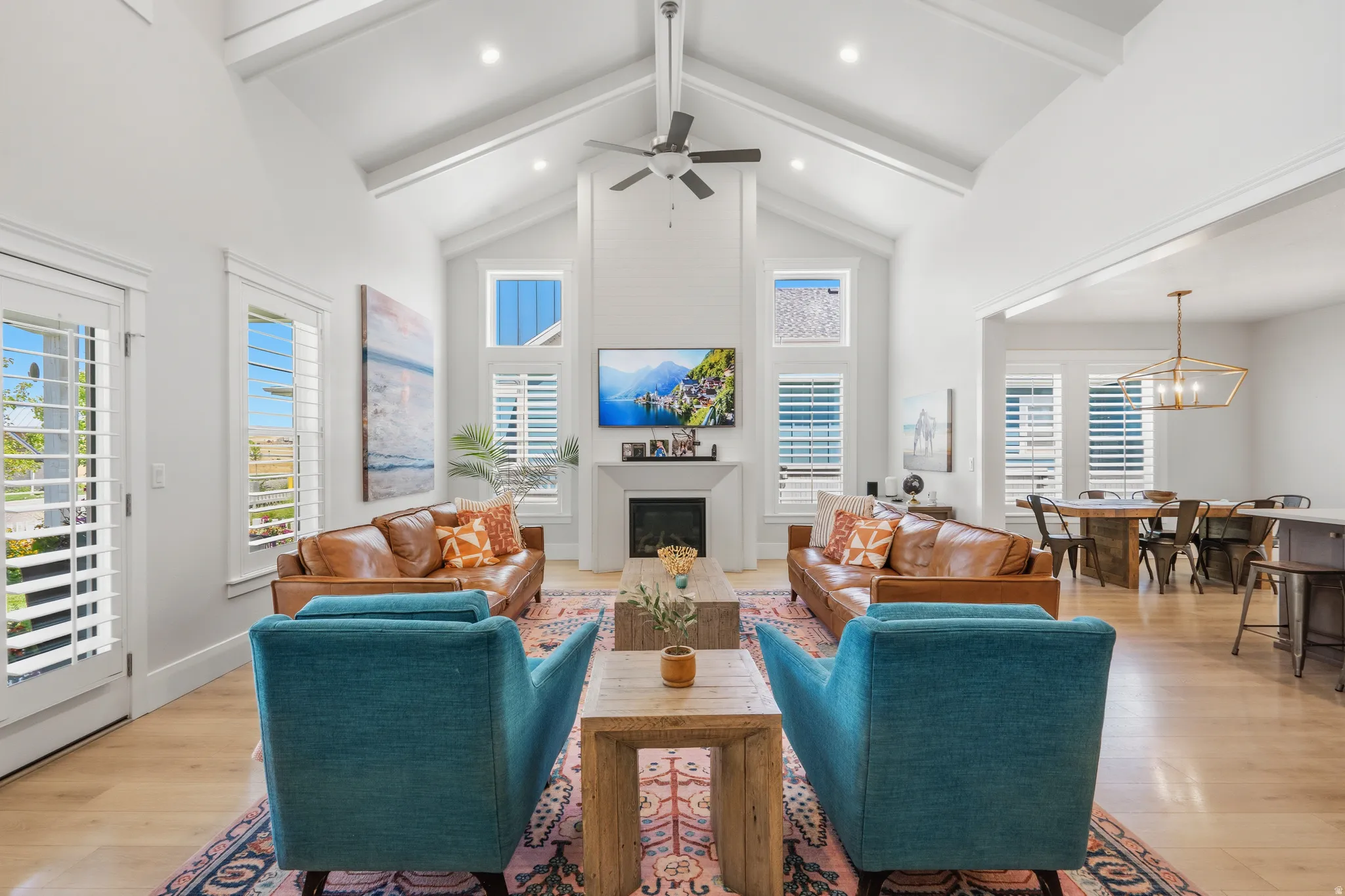 Vaulted ceiling with exposed beams and recessed lighting