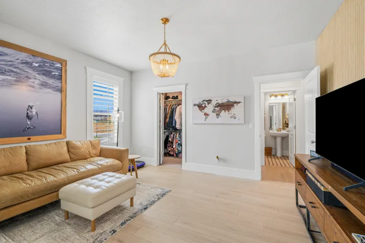 Light wood-finish flooring complements the neutral wall tones
