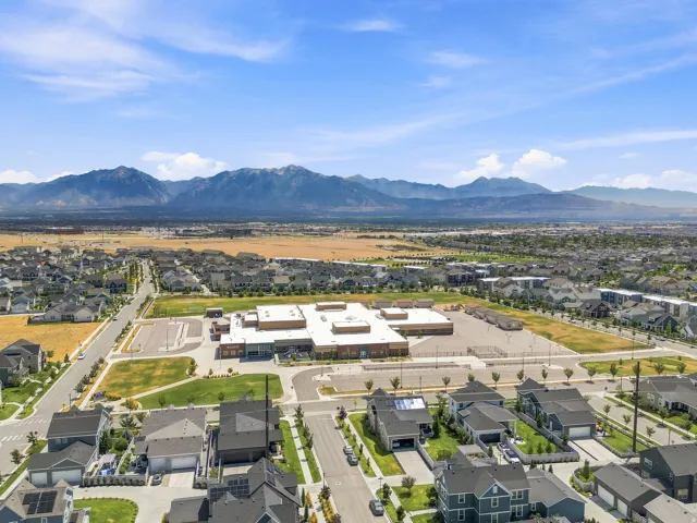 Expansive residential area featuring numerous single-family homes with gray roofs and varied architectural styles