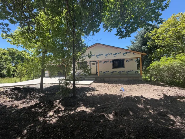 New construction property featuring a single-story design, a covered front porch with wood columns, and a concrete foundation