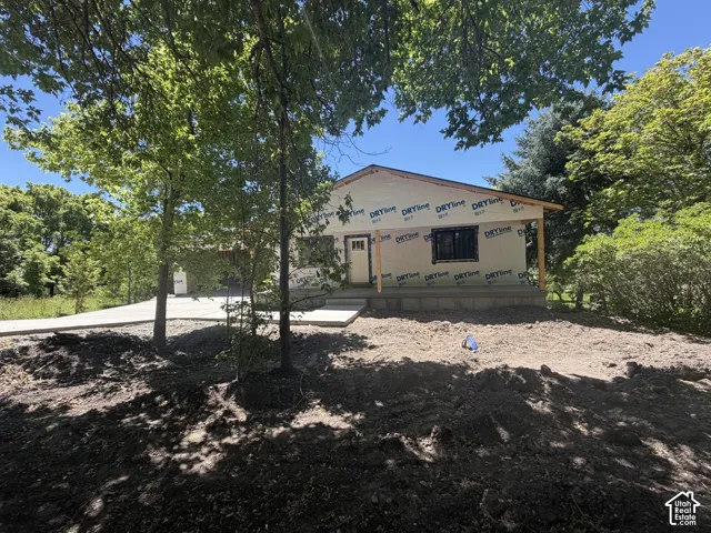 New construction property featuring a single-story design, a covered front porch with wood columns, and a concrete foundation
