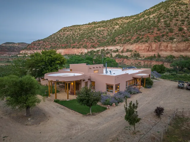 Southwestern-style residence featuring a stucco exterior and a flat roofline