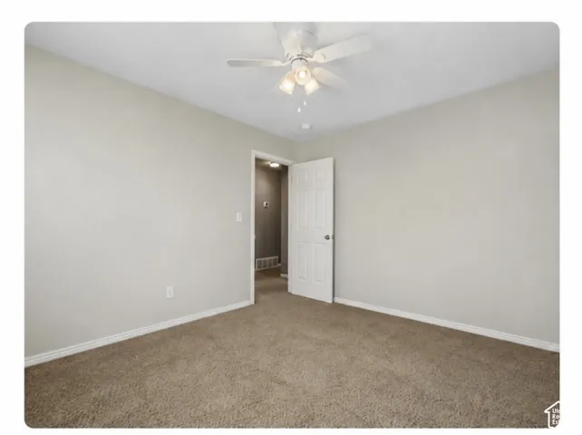 Neutral-toned walls and carpet flooring