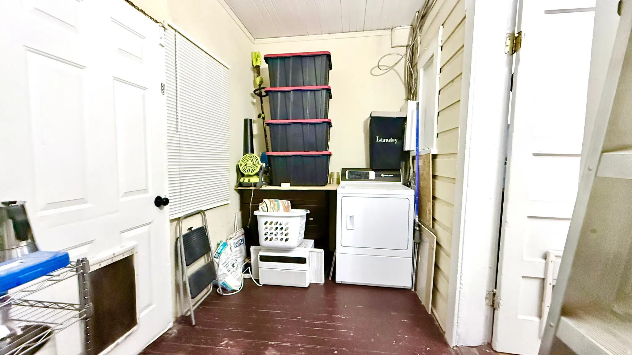 Dedicated laundry area featuring a white dryer appliance