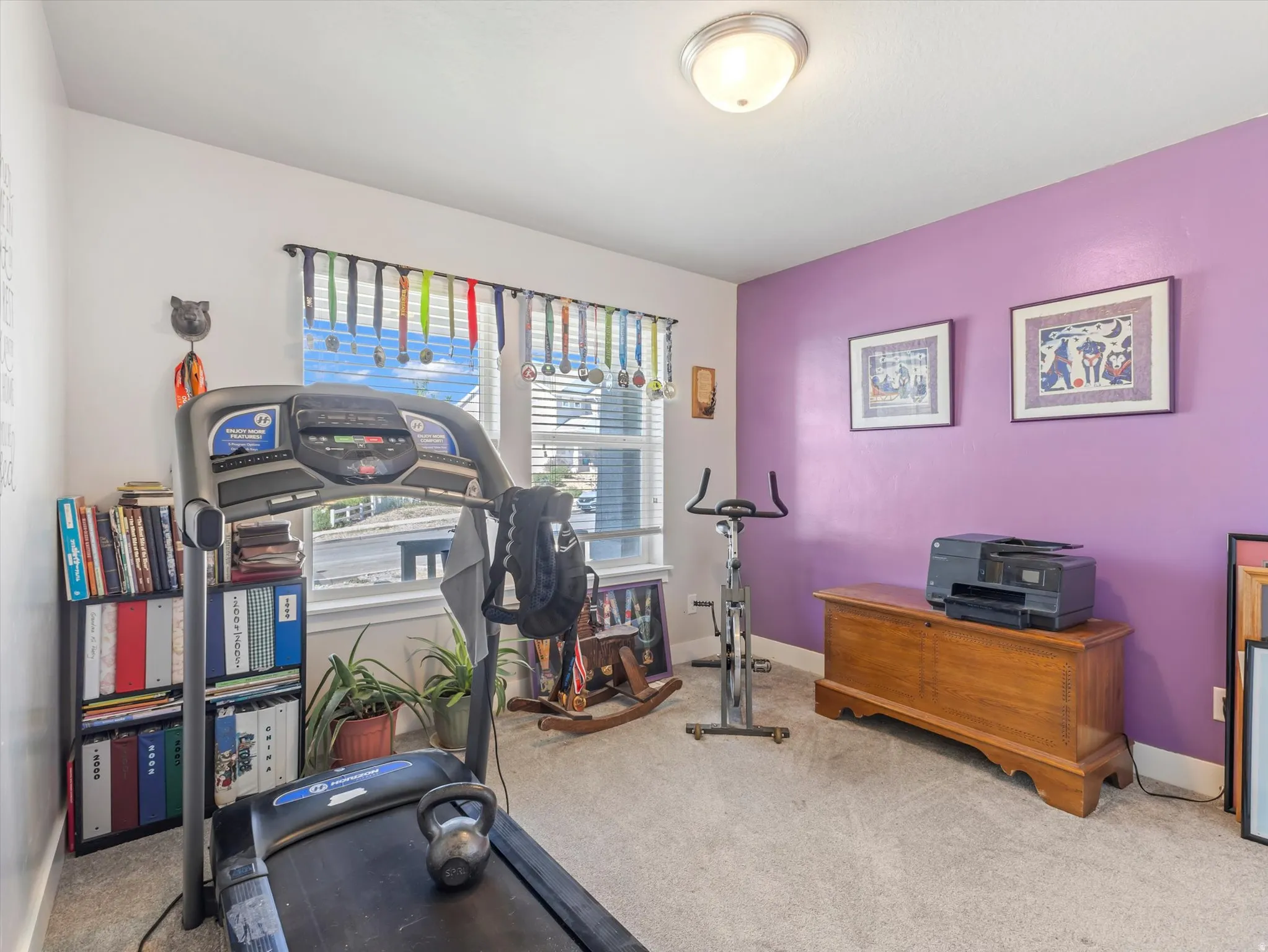 Interior room featuring a mix of painted walls, a window with horizontal blinds, and neutral carpet flooring