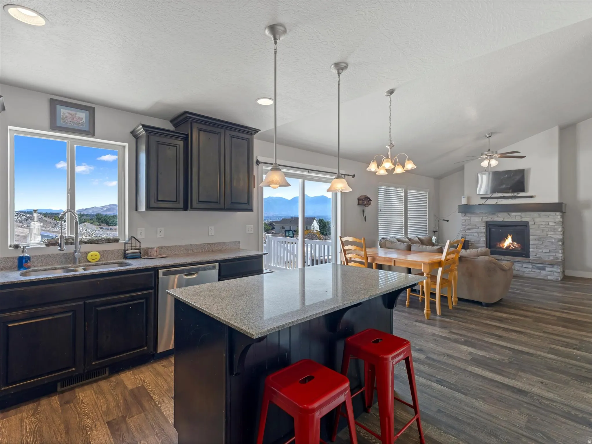 Open-concept living space with wood-finish flooring