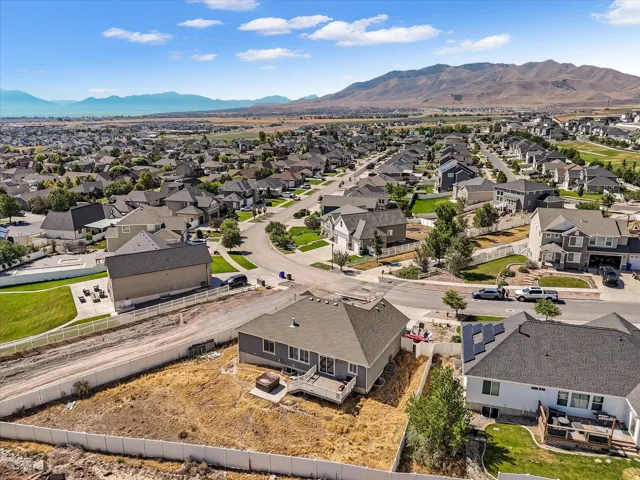 Residential neighborhood featuring single-family homes with mountain and distant water scenery