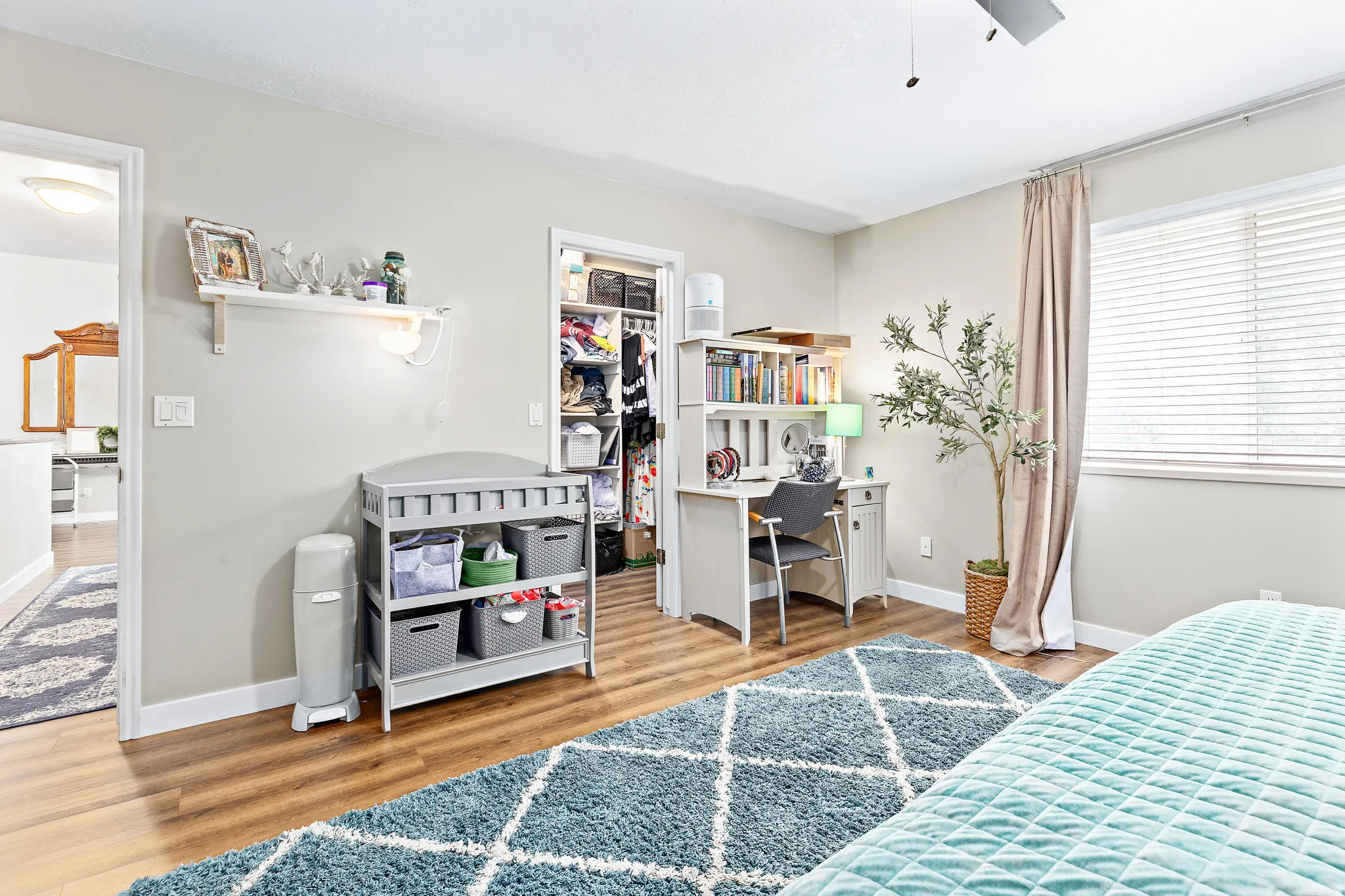 Light-colored walls complement the wood-finish flooring