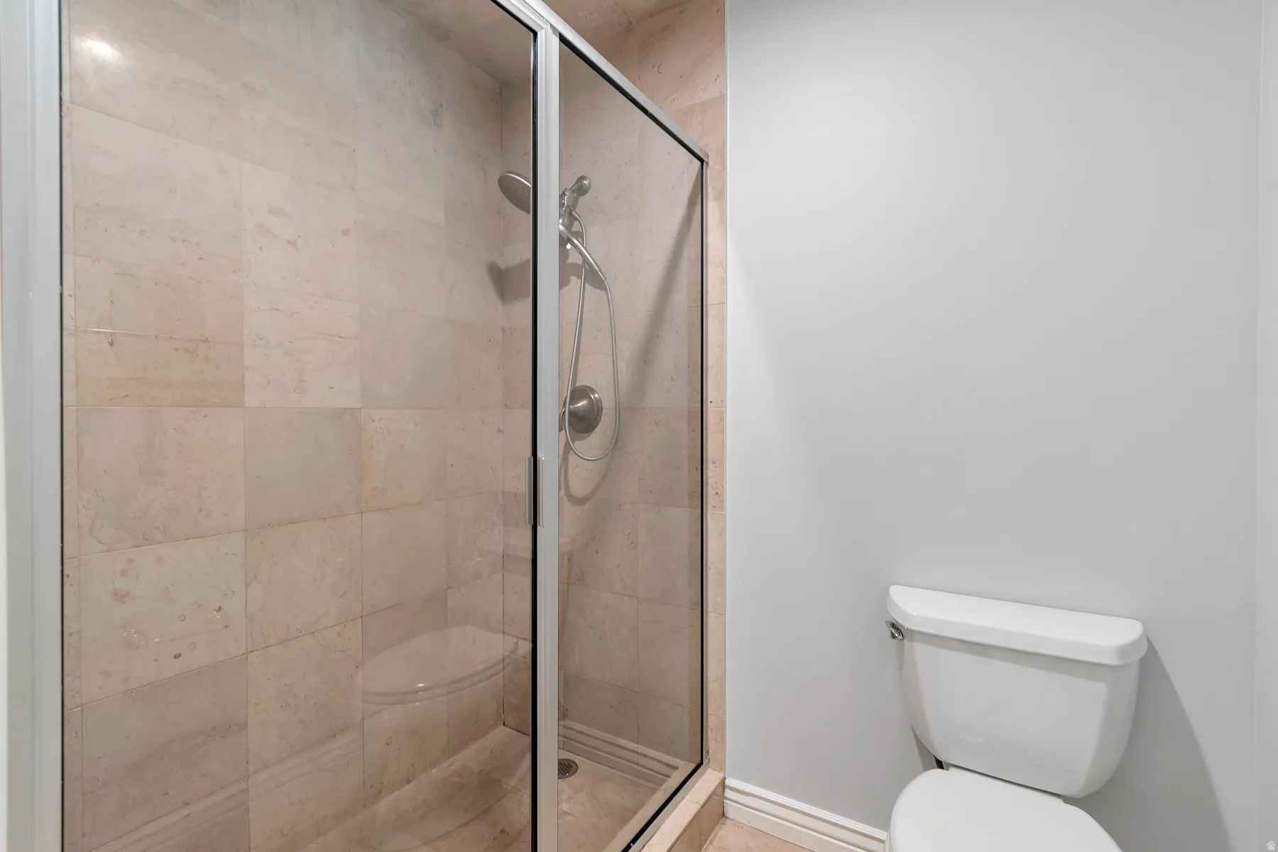 Primary bathroom with walk-in shower.