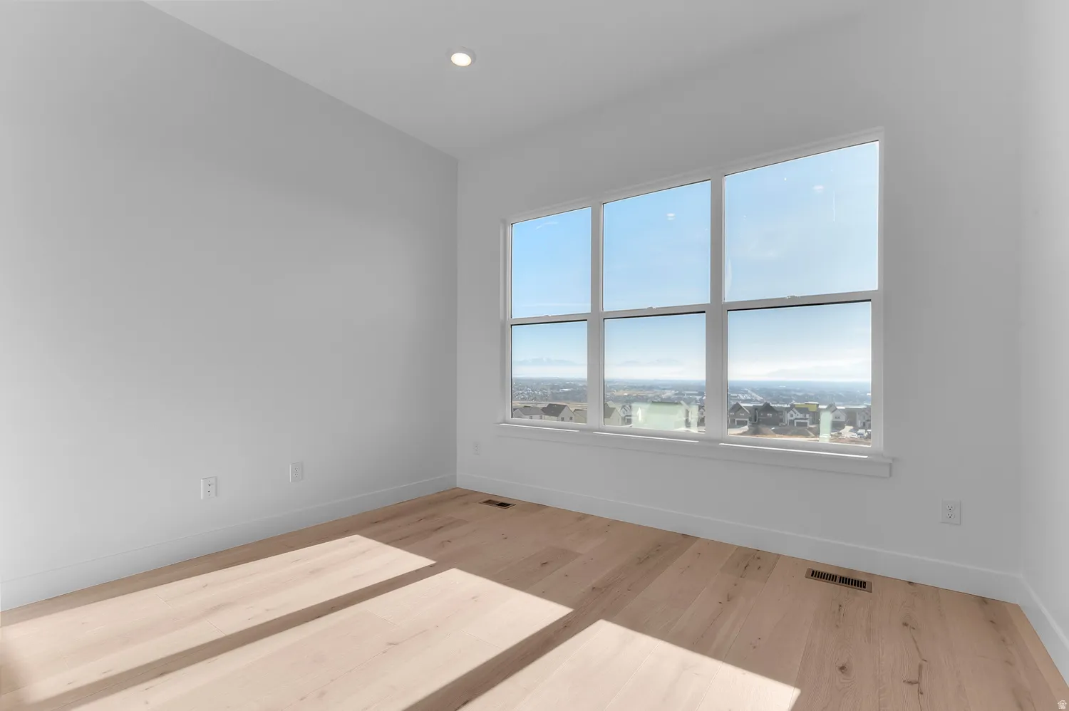 Expansive window offering a wide outdoor panorama