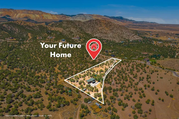 Expansive land parcel featuring a single-family residence, abundant natural foliage, and mountain topography