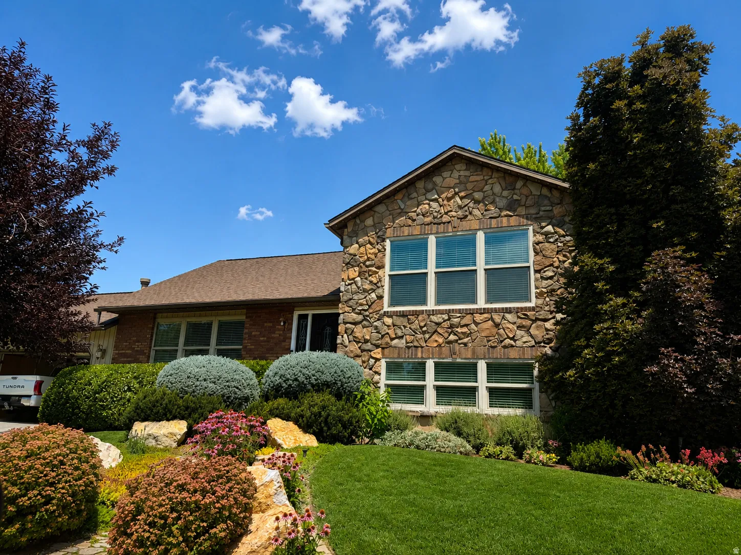 Stone and brick facade with a gabled architectural element