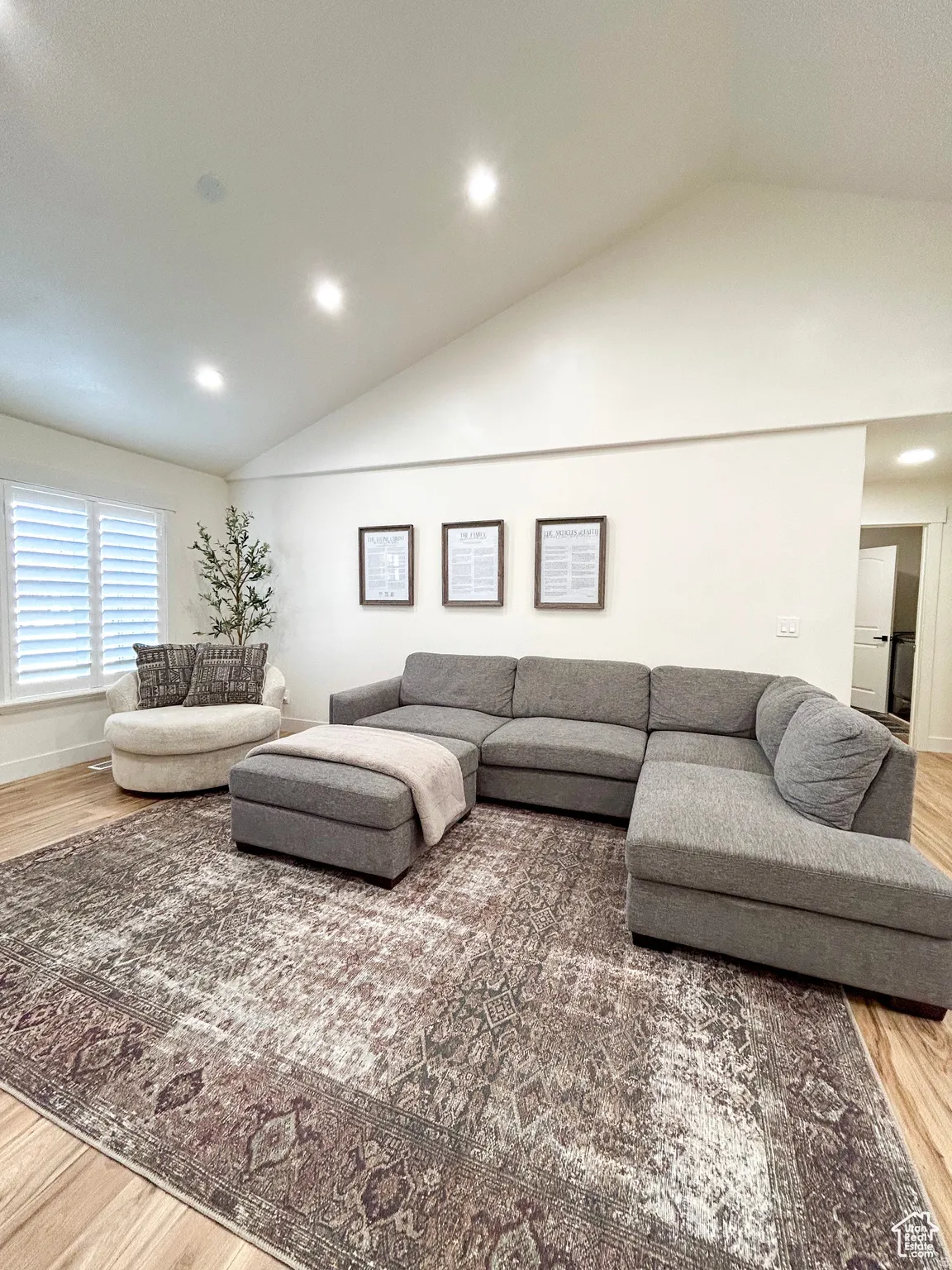 Vaulted ceiling featuring recessed lighting