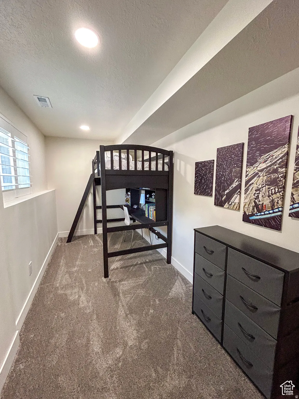 Plush carpeted flooring, recessed lighting, and a white baseboard trim
