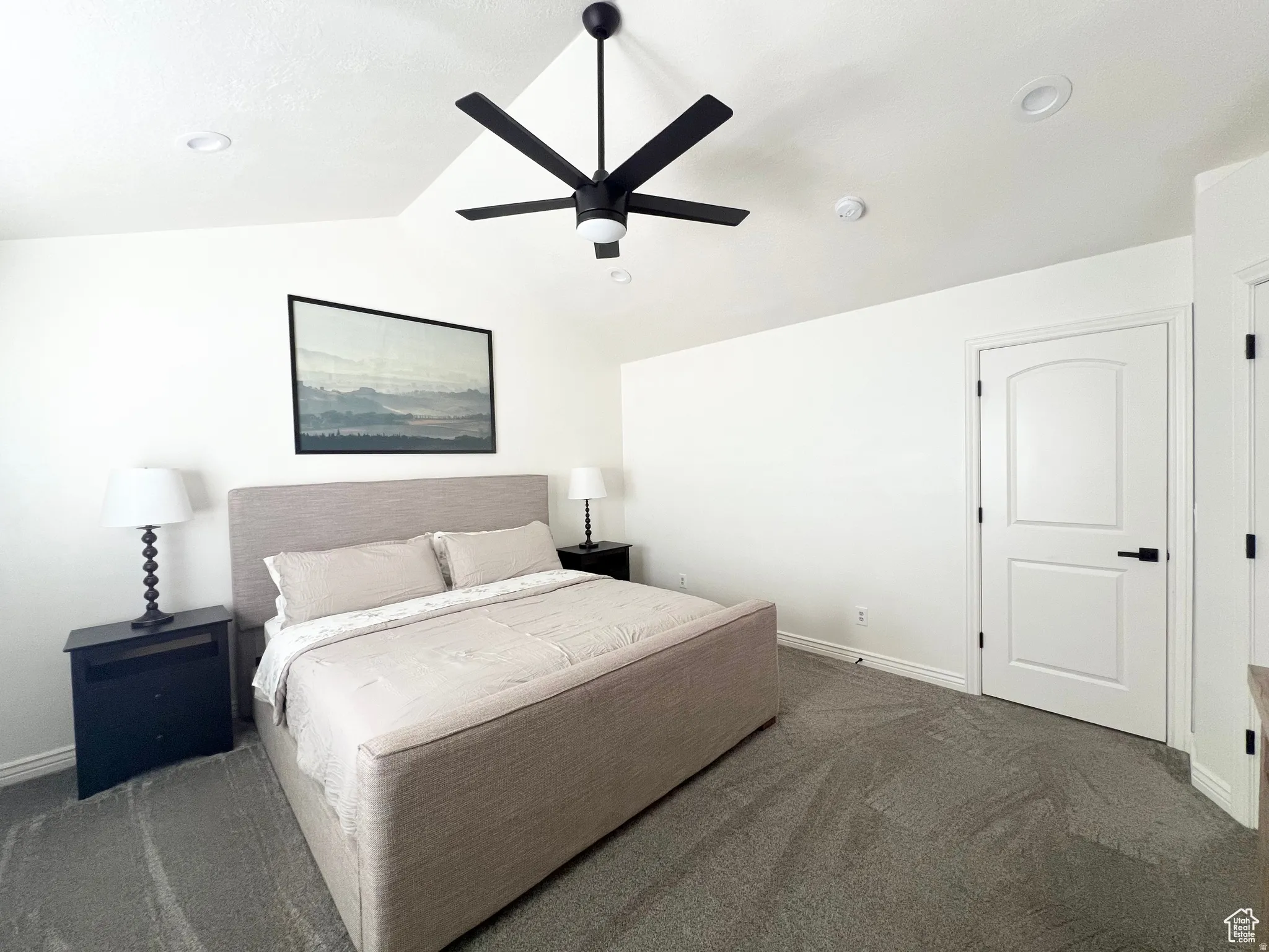 Vaulted ceiling featuring a ceiling fan