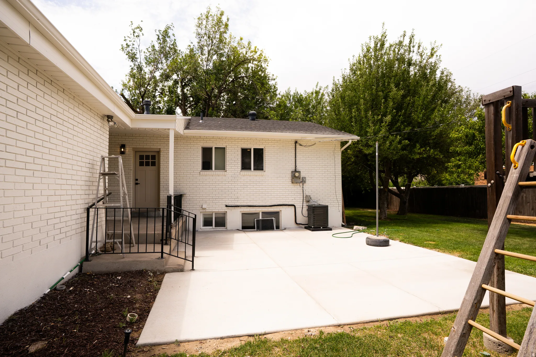 Expansive concrete patio offering generous outdoor living space