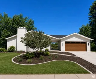White siding exterior with a prominent chimney feature, a wood-finish garage door, and a covered entryway