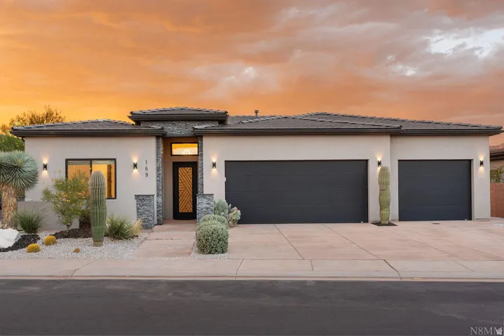Contemporary stucco exterior featuring a stone accent façade