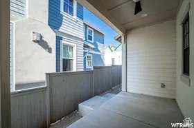 Covered concrete patio with a ceiling fan, recessed lighting, and horizontal siding