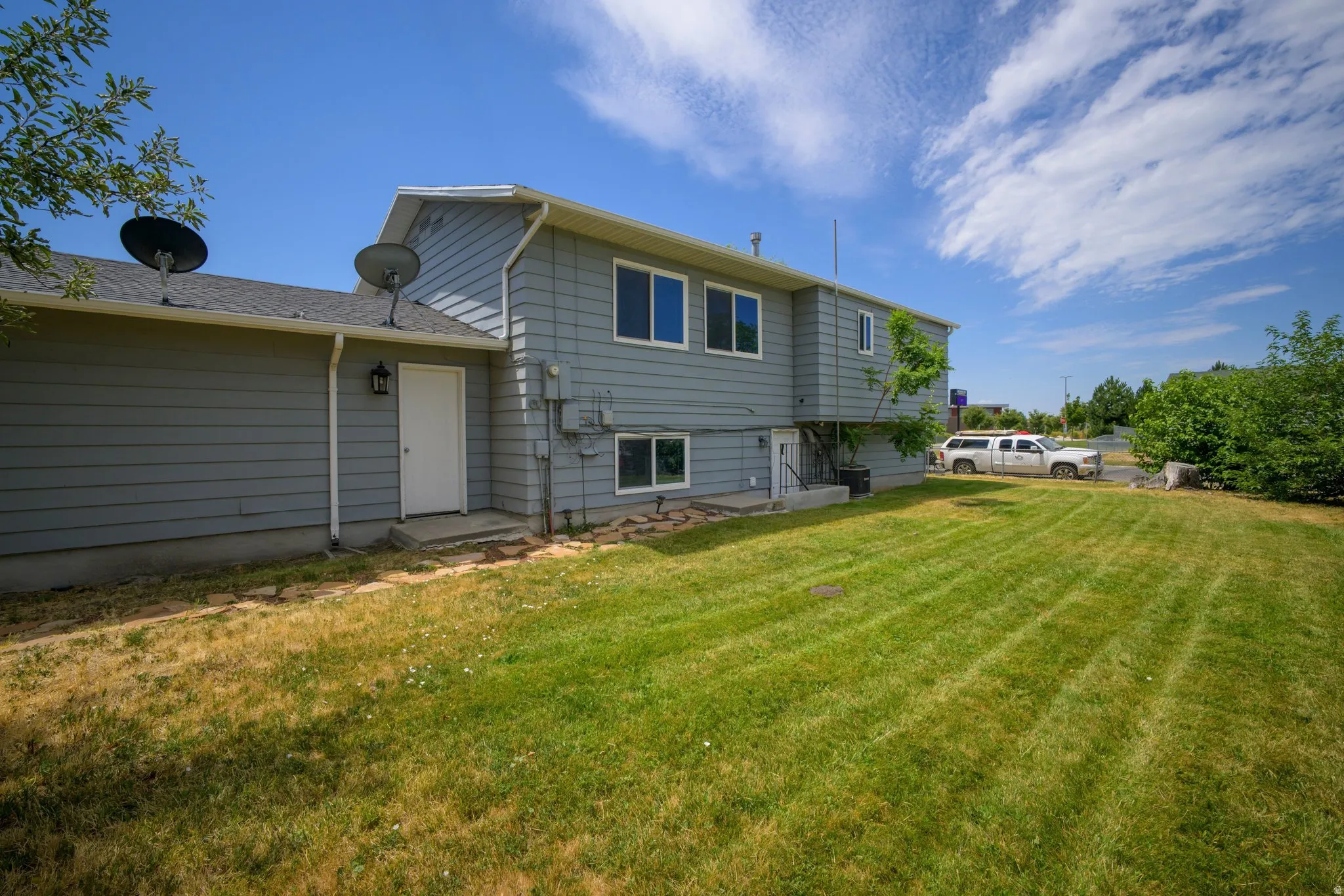 Exterior siding in a light gray finish