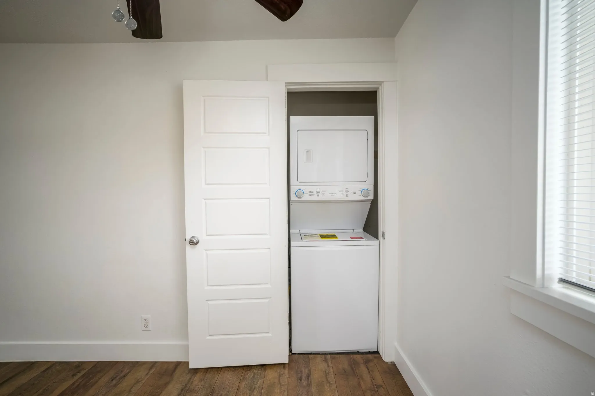 Dedicated laundry closet with stacked washer and dryer unit